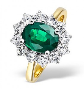 Engagement ring with green emerald